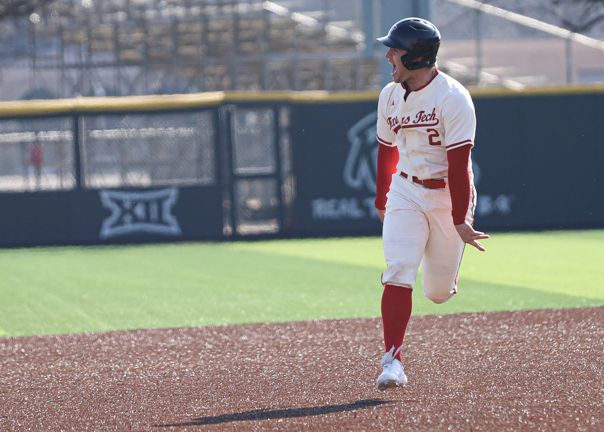 Texas Tech baserunner celebrating