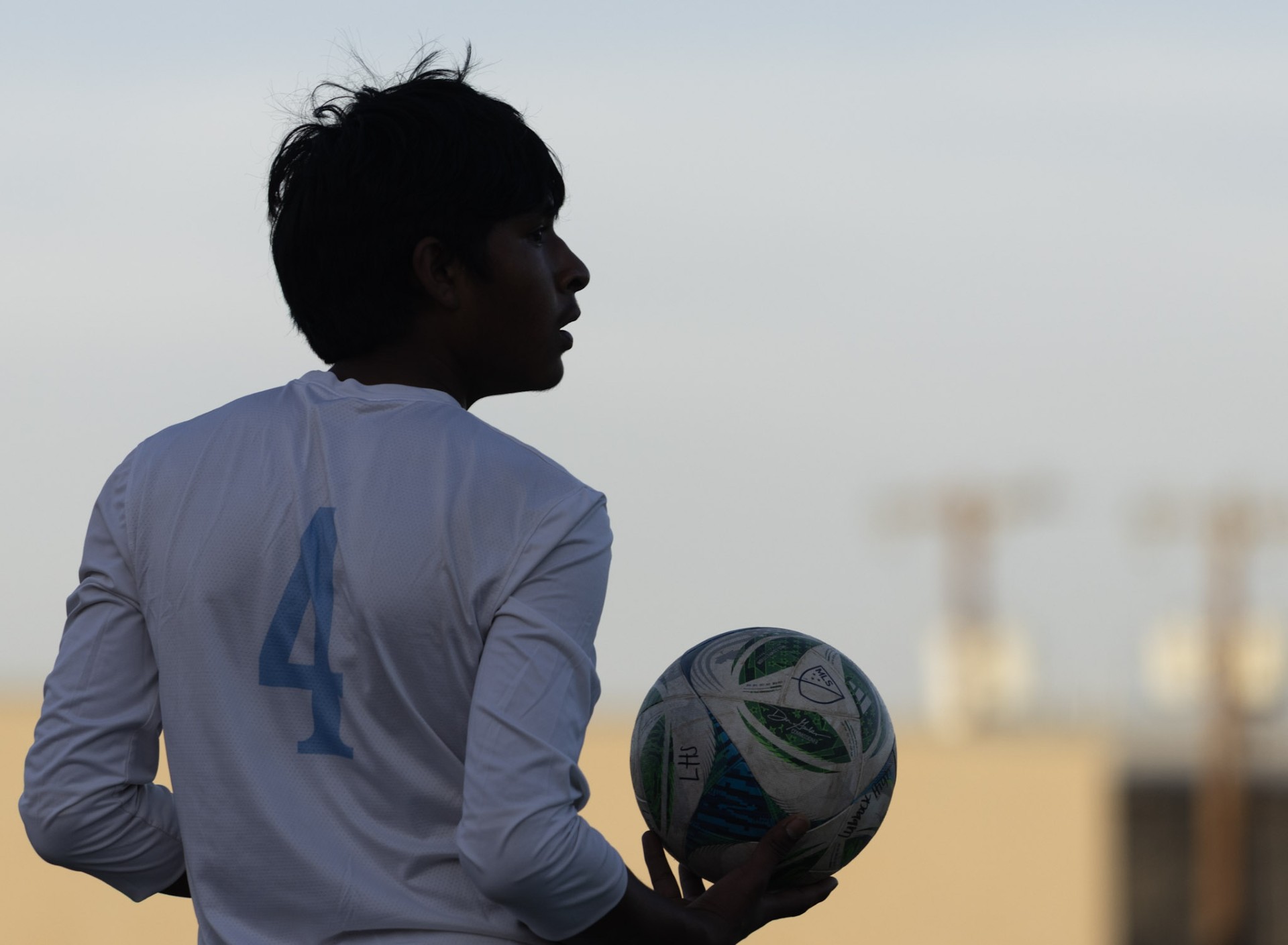 Player silhouette with ball