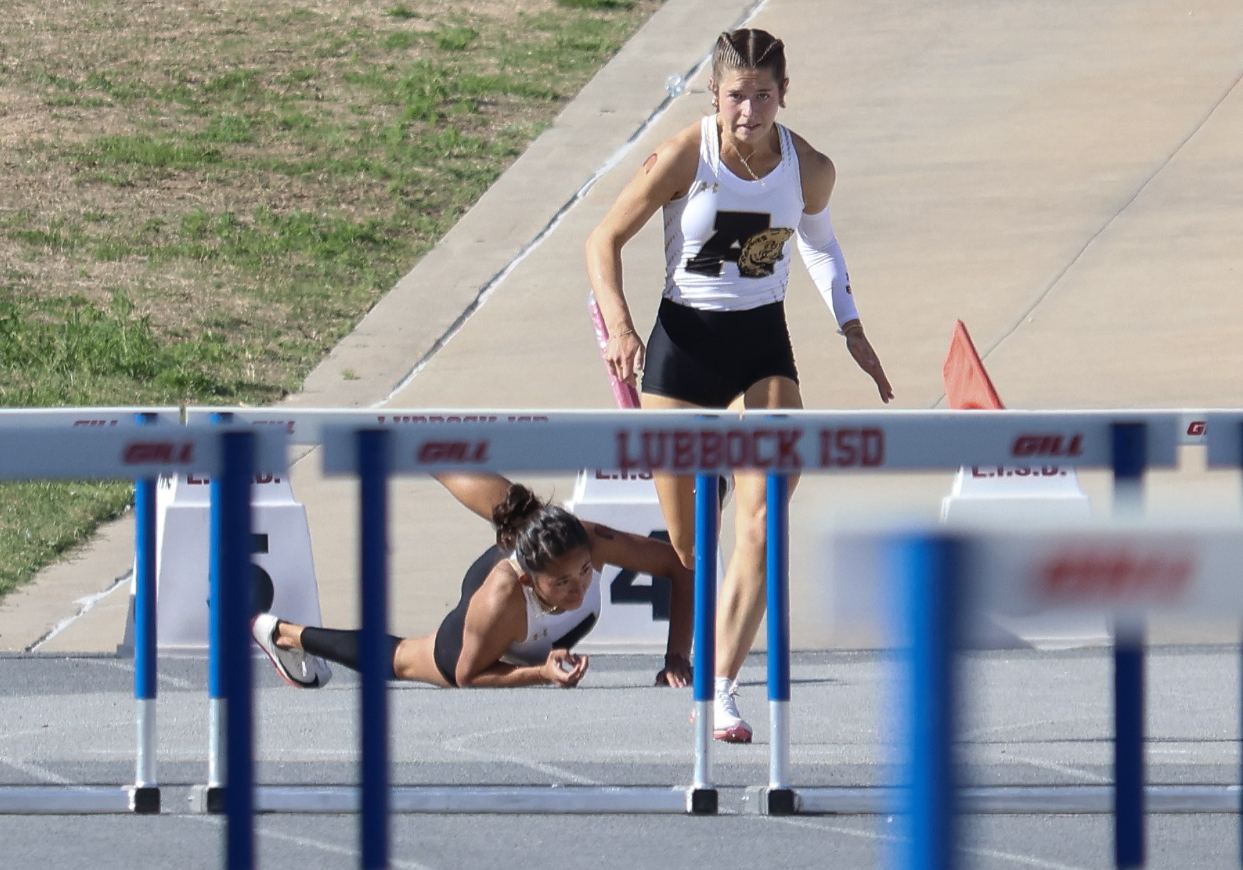 Hurdle fall — Lubbock ISD meet