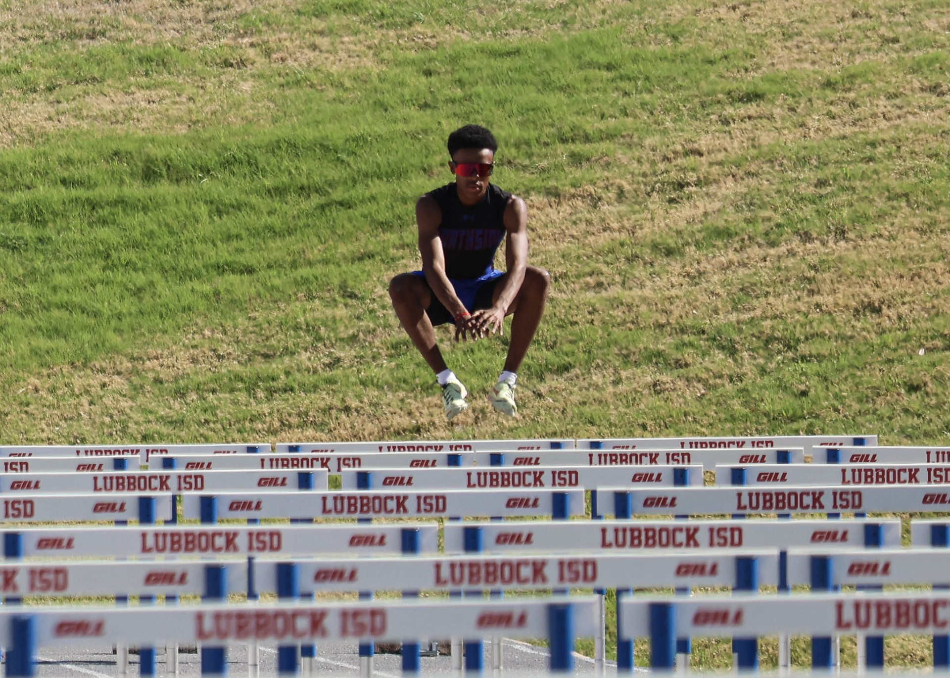 Hurdler sitting — Lubbock ISD