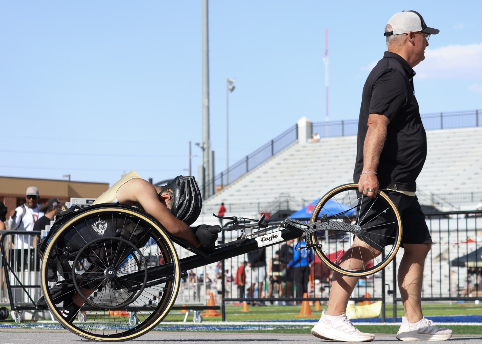 Wheelchair racer with coach
